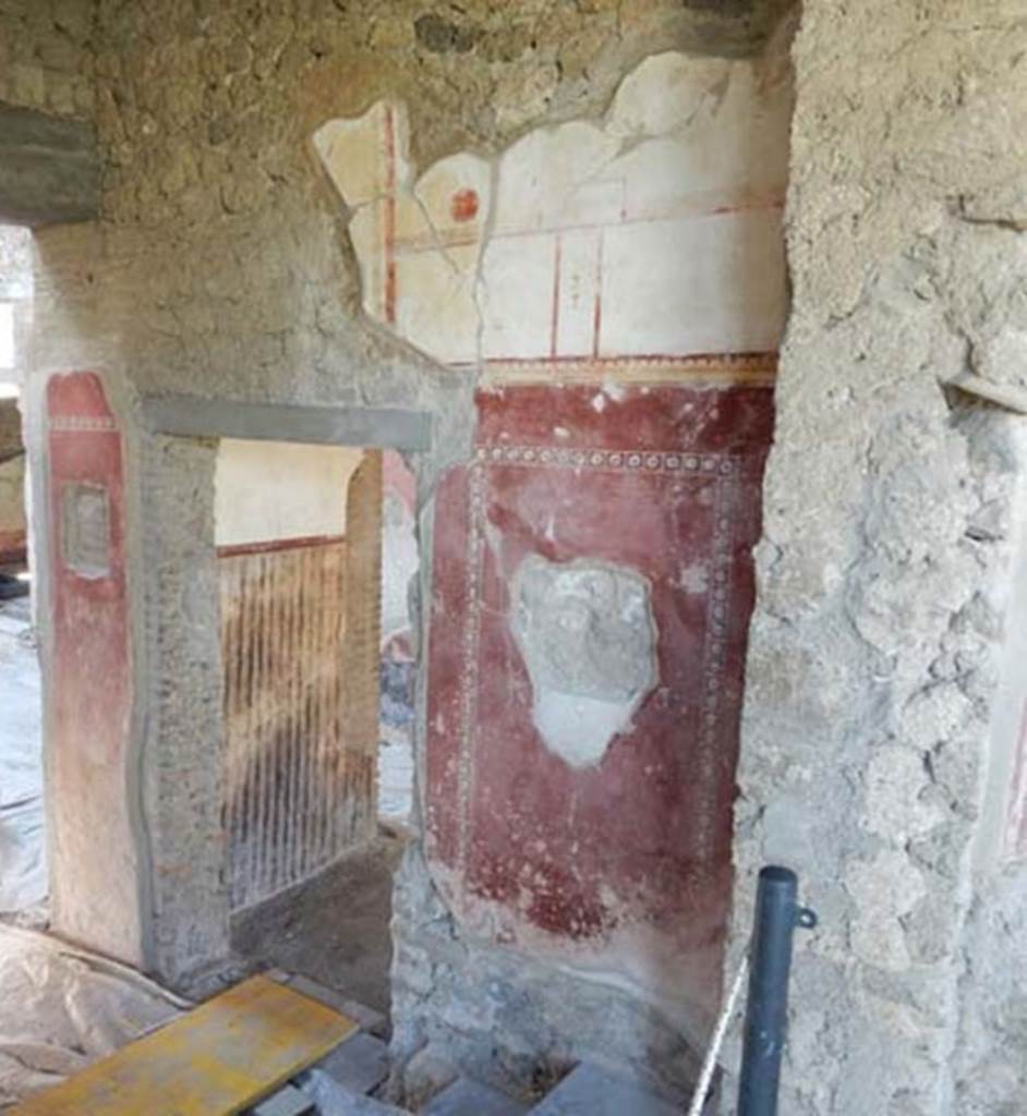 II.4.10 Pompeii. June 2019. Threshold of doorway leading west in atrium at base of steps from portico.
Photo courtesy of Buzz Ferebee.
