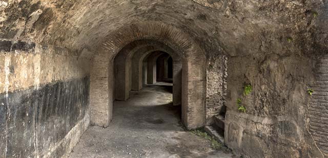 II.6 Pompeii. December 2006. Small dark room on west side of entrance corridor of Amphitheatre, possibly a storeroom.