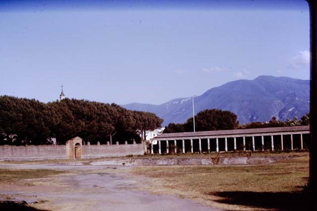 II.7 Pompeii. June 2019. Looking south-east across pool towards entrance at II.7.2, centre, and II.7.1, on right.
Photo courtesy of Buzz Ferebee.

