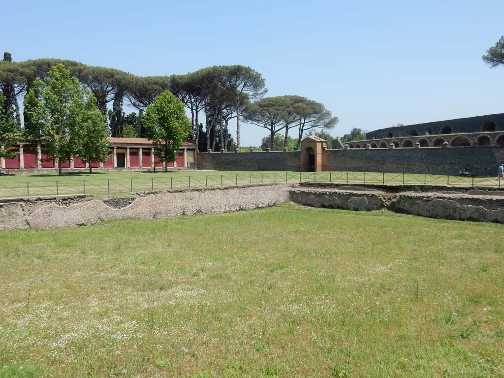 II.7 Pompeii. June 2019. Looking across pool towards north-east corner, and east side with entrance at II.7.4, centre right.
Photo courtesy of Buzz Ferebee.
