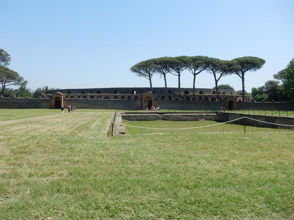 II.7 Pompeii. June 2019. Looking east across pool in Palestra, with entrance doorway at II.7.4. II.7.3 in centre, and II.7.2
Photo courtesy of Buzz Ferebee.
