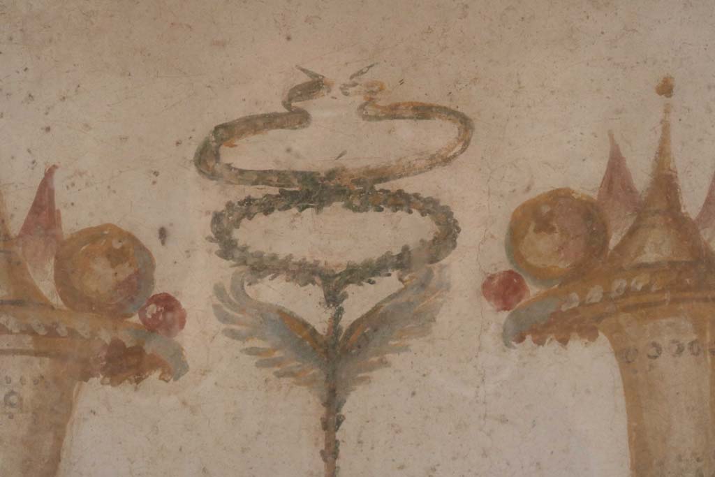 II.9.1 Pompeii. December 2018. 
Detail of painting of Horn of Plenty on north side of column on the north side of the triclinium. Photo courtesy of Aude Durand.

