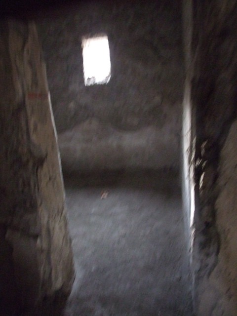 II.9.3 Pompeii. December 2007.  
Doorway to room 12 on south side of entrance. Looking towards west wall.
