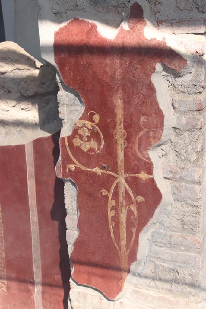 III.3.6 Pompeii. October 2023. 
Detail of painted decoration on pilaster in east wall. Photo courtesy of Klaus Heese.
