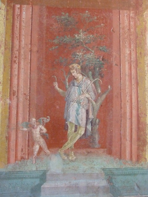 III.4.b Pompeii. 1968. Room 3, east wall of oecus, detail of wall painting of Attis. 
Photo by Stanley A. Jashemski.
Source: The Wilhelmina and Stanley A. Jashemski archive in the University of Maryland Library, Special Collections (See collection page) and made available under the Creative Commons Attribution-Non Commercial License v.4. See Licence and use details.
J68f0334
