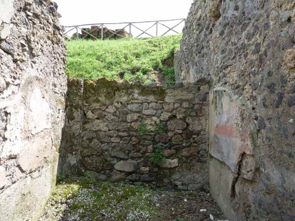 III.8.3 Pompeii. May 2010. South blocked wall, with a door to rear.