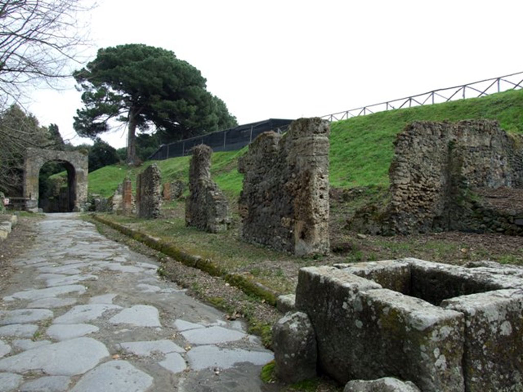 III.11.1 Pompeii. March 2009. Via di Nola looking east to Nola Gate, taken from outside III.11.1 and fountain.
