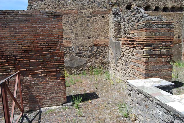V.1.1 Pompeii. December 2007. Looking north to rear rooms with the entrance doorway at V.1.32, on the left.
