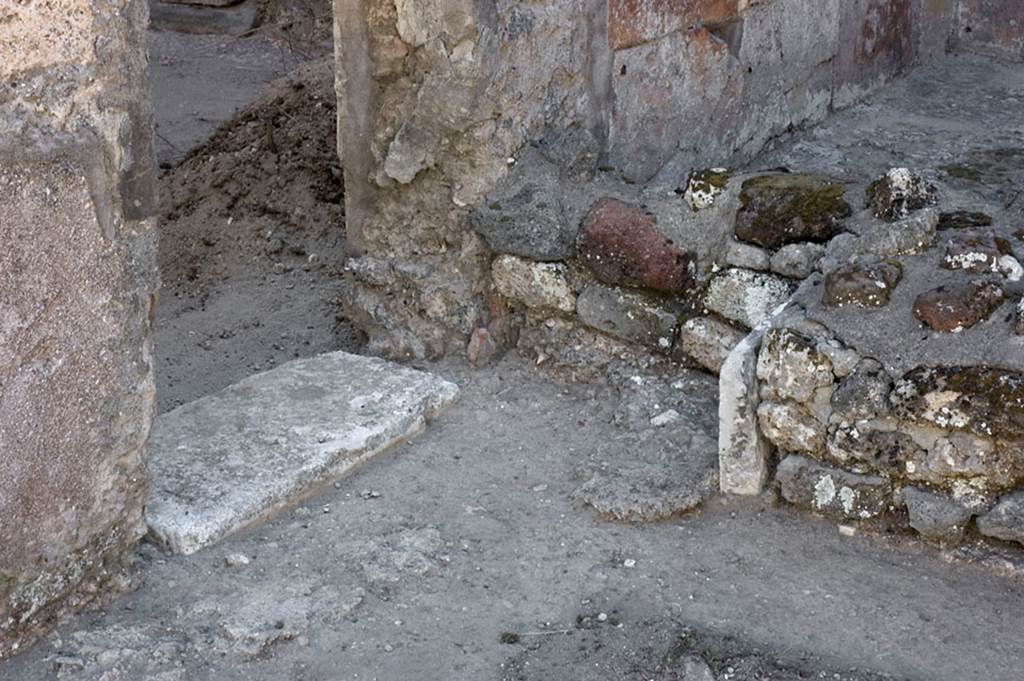 V.1.7 Pompeii. c.2005-7. Room 14, south wall with threshold of doorway to room 15. Photo by Hans Thorwid. 
Photo courtesy of the Swedish Pompeii Project. 

