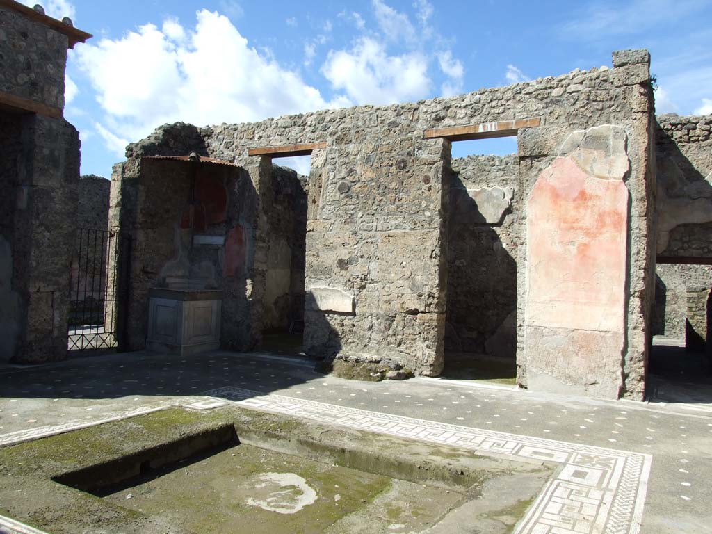 V.1.26 Pompeii. March 2009. Room “b”, doorway to shop at V.1.25, lararium, two cubicula and ala on north side of atrium.