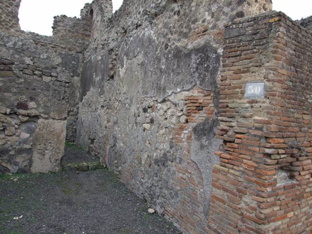 V.1.30 Pompeii. March 2009. Rear room, south-east corner. Waste pipe from upper floor niche latrine.

