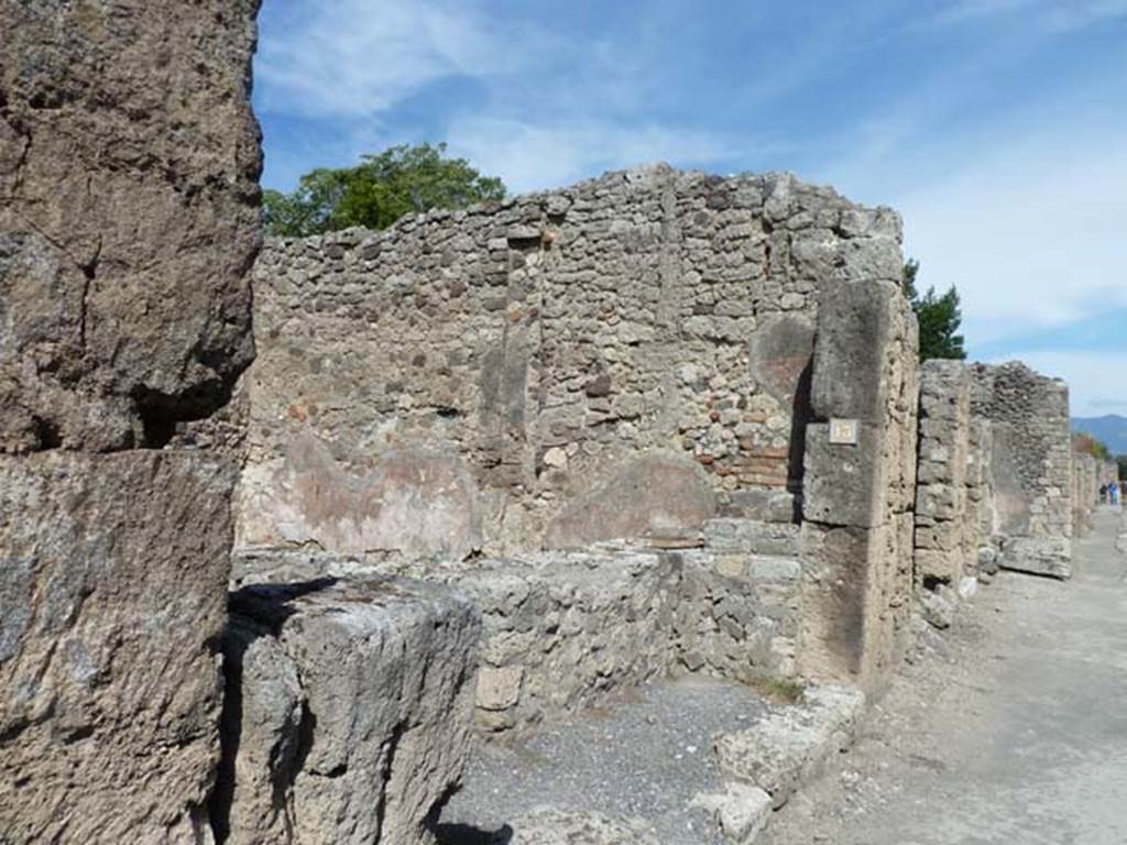 V.2.13, on right, Pompeii. December 2018. 
Looking north to entrances on Via di Nola, with V.2.12, on left. Photo courtesy of Aude Durand.

