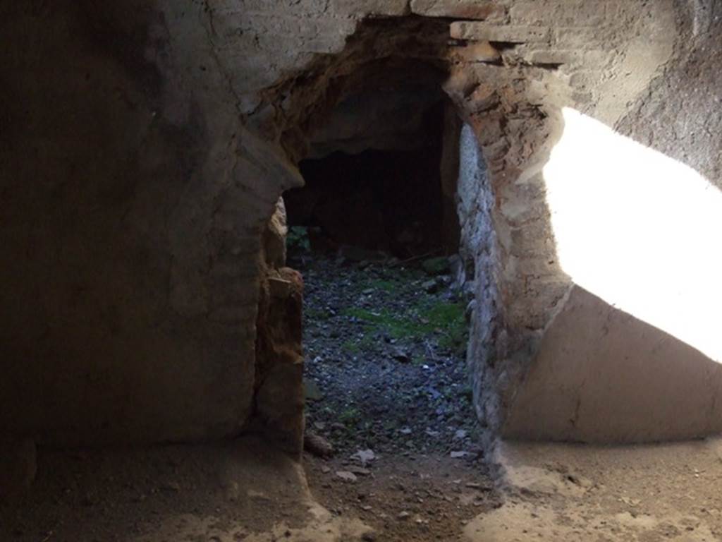 V.2.i Pompeii. December 2007. Room 16, north wall of caldarium.  Looking north into the hole in the floor and wall of the kitchen area.  

