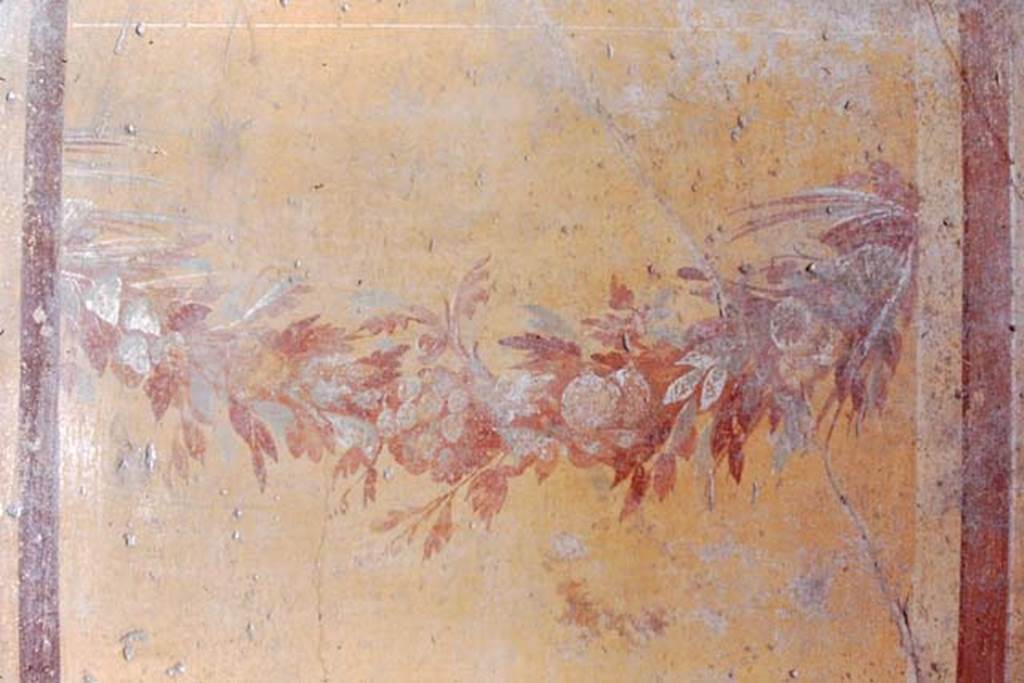 V.2.i Pompeii. December 2007.  Room 17, painted female figure on wall in oecus on south-west corner of peristyle. 

