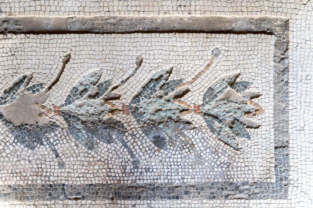 V.2.i Pompeii. March 2023. Room 20, detail from mosaic door threshold. Photo courtesy of Johannes Eber.