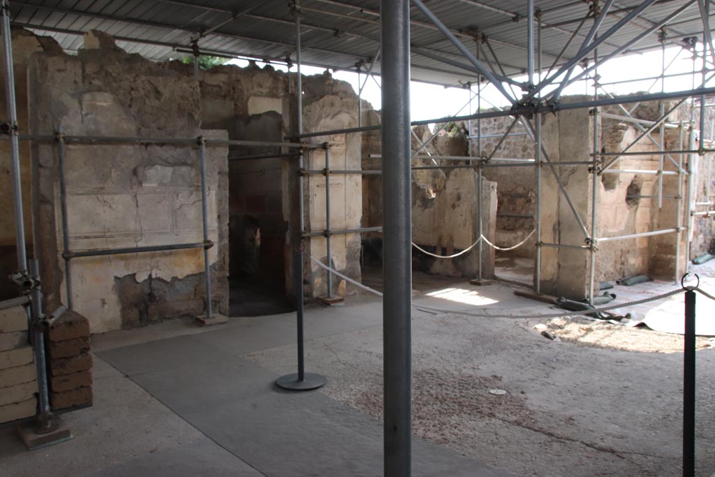 V.2.Pompeii. Casa di Orione. September 2021. 
Looking towards doorways to rooms A17, A11, and A13 on south side of atrium A12. Photo courtesy of Klaus Heese.
