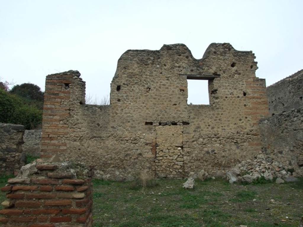 V.3.8 Pompeii.  December 2007.  North wall of garden (a) with windows and blocked door.