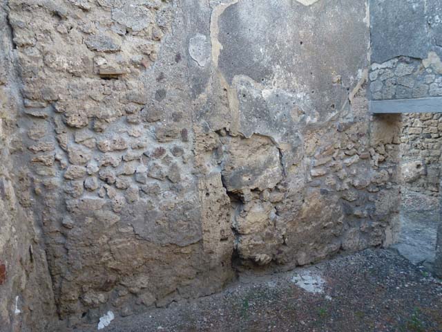 V.3.8 Pompeii. June 2012. North wall of front room on west side of entrance corridor.
Photo courtesy of Michael Binns.
