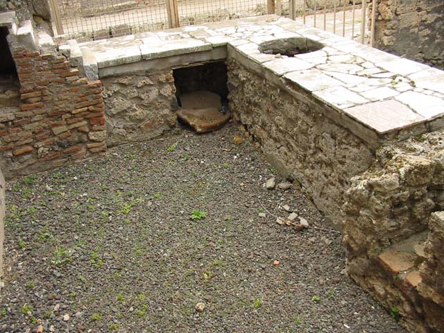V.4.7 Pompeii. May 2017. Area under counter, looking south from behind counter.
Photo courtesy of Buzz Ferebee.
