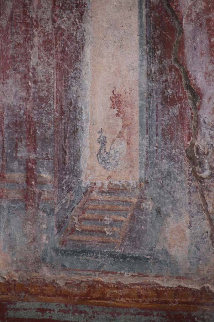 V.6.12 Pompeii. October 2020. Amb. 9. 
Detail from architectural decoration (? a peacock) on west side of central painting on south wall of cubiculum.
Photo courtesy of Klaus Heese.
