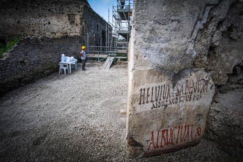 V.7.8 Pompeii. June 2018. Electoral inscriptions on outside east wall around the corner in Vicolo c.d. dei Balconi.
Looking west along new excavated part of Vicolo delle Nozze d’Argento towards V.2.i, from electoral inscriptions.  
Photograph © Parco Archeologico di Pompei.