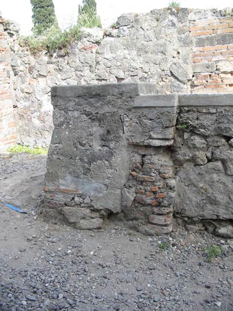 VI.1.2 Pompeii. December 2018. Looking south across counter and hearth, from north side. Photo courtesy of Aude Durand. 