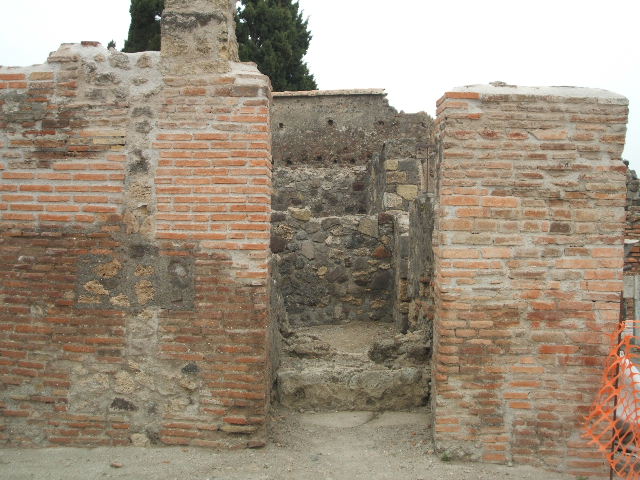 VI.1.3 Pompeii.  May 2005.  Steps to upper floor looking east.
