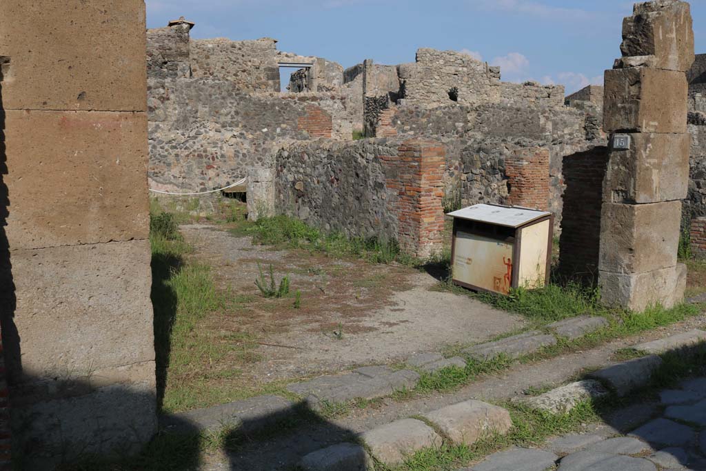 VI.1.14, Pompeii. December 2018. 
Looking east to entrance doorway, numbered on plaque as VI.1.15. Photo courtesy of Aude Durand.
