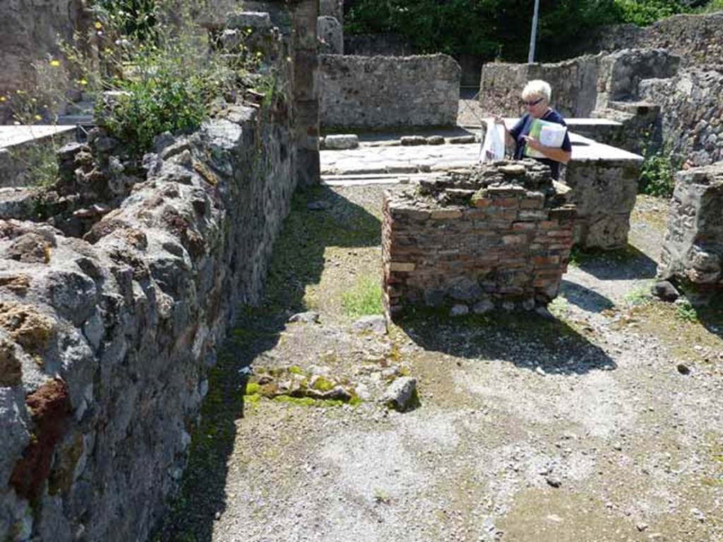 VI.1.17 Pompeii.  May 2010. Looking west across bar towards Via Consolare 
In the rear room, the remains of the steps to upper floor can be seen on the left.

