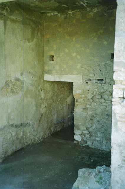 VI.2.4 Pompeii. June 2010. Doorway to cubiculum in south-east corner of garden apartment. Photo courtesy of Rick Bauer.
It should be noted that, apart from the west side, the house was entirely destroyed by the bombing during the night of 14/15th September 1943. 
According to Laidlaw, the roof, the south apartment, and the portico behind the main house block are almost completely modern reconstructions made in 1970-71.
See Garcia y Garcia, L., 2006. Danni di guerra a Pompei. Rome: L’Erma di Bretschneider. (p. 66-74)
