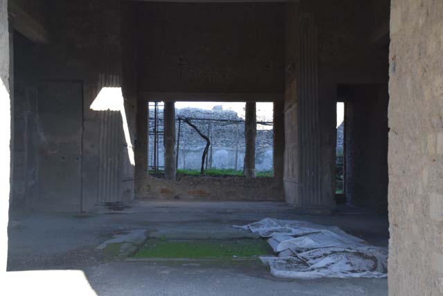 VI.2.4 Pompeii. September 2004. Looking east across atrium and impluvium.
Apart from the west side, the house was entirely destroyed by the bombing during the night of 14/15th September 1943.  According to Laidlaw, the roof, the south apartment, and the portico behind the main house block are almost completely modern reconstructions made in 1970-71. See Garcia y Garcia, L., 2006. Danni di guerra a Pompei. Rome: L’Erma di Bretschneider. (p. 66-74)
