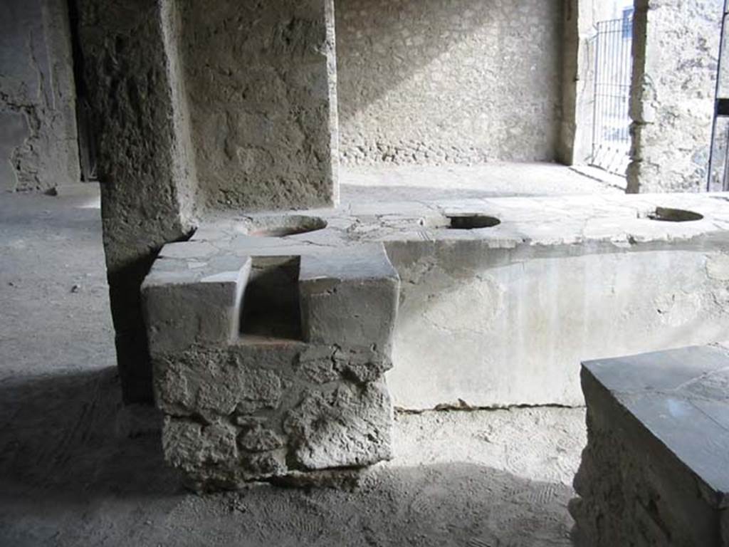 VI.2.5 Pompeii. May 2003. Hearth at rear of counter, looking south. Photo courtesy of Nicolas Monteix.