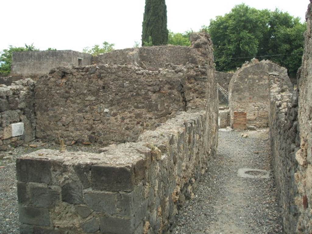 VI.2.7 Pompeii. May 2005. Looking west along corridor from rear room to site of separate steps to upper floor at VI.2.8.