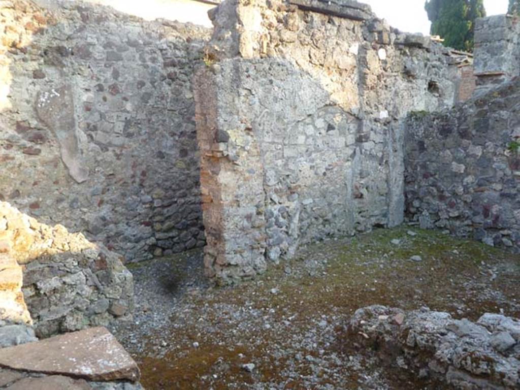 VI.2.16 Pompeii. May 2011. Looking south-west across kitchen area, towards a corridor leading to the garden area. The area on the right would probably have been a storeroom, according to Fiorelli.
