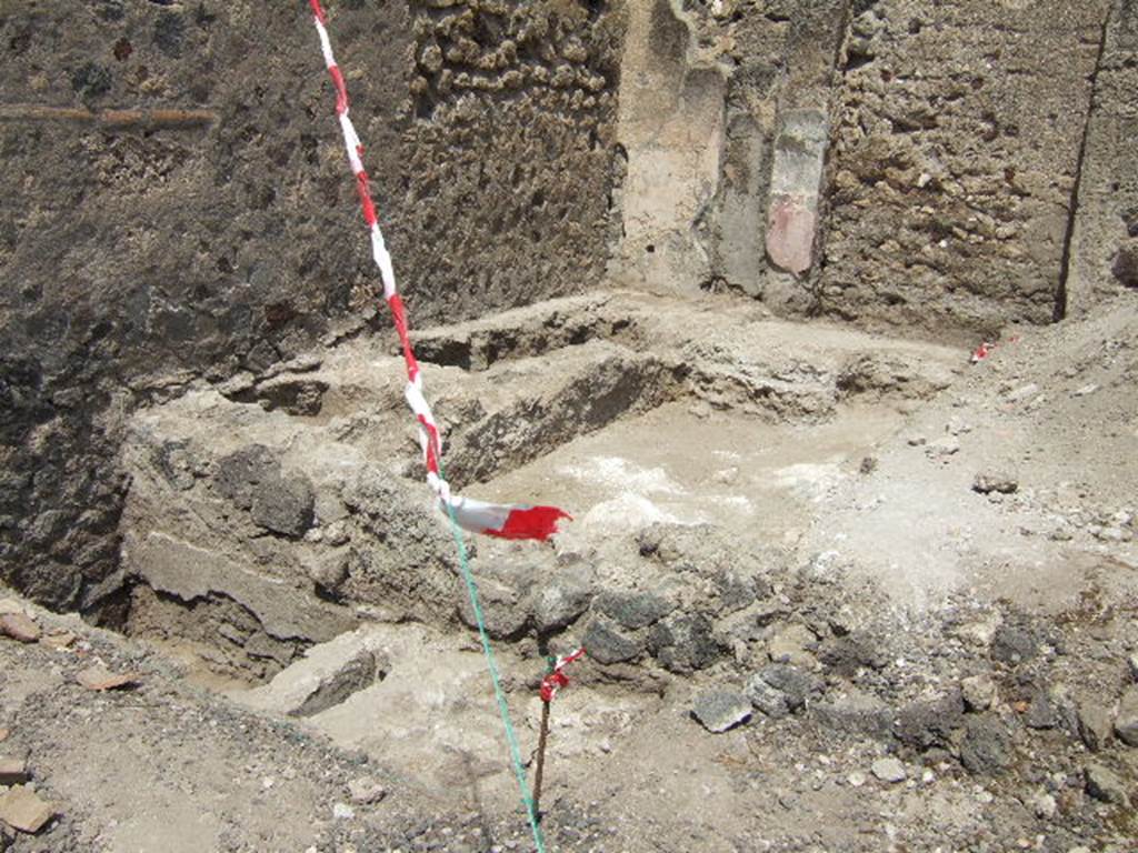 VI.2.32 Pompeii. May 2006. Excavation to lower level of floor in east end of rear room of shop.