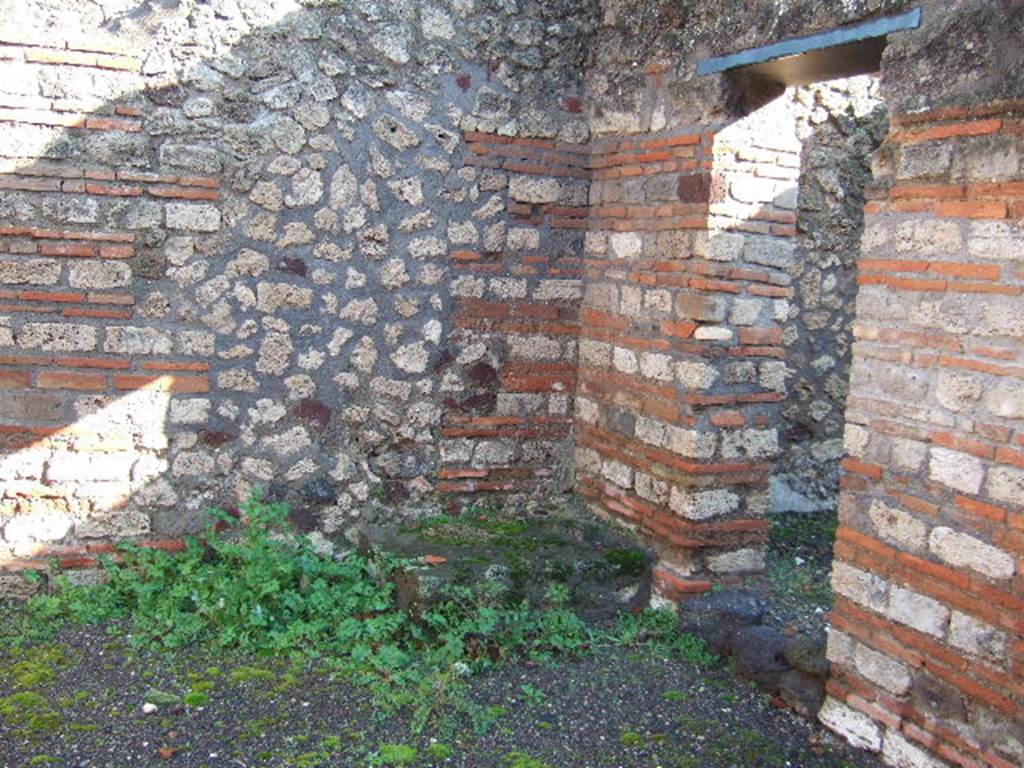 VI.3.1 Pompeii. December 2007. South-east corner of shop, with doorway into storeroom on south side under stairs at VI.3.2.