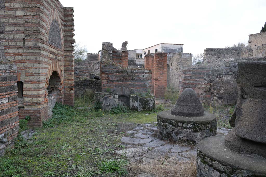 VI.3.3 Pompeii. December 2018. 
Room 7, looking west across south side of mill-room towards doorways to rooms 5 and 4. Photo courtesy of Aude Durand.

