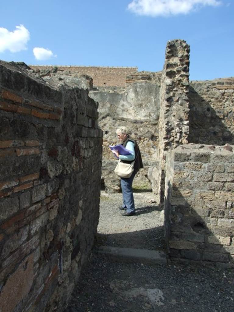 VI.3.3 Pompeii. March 2009. Doorway to room 8, latrine and kitchen. 