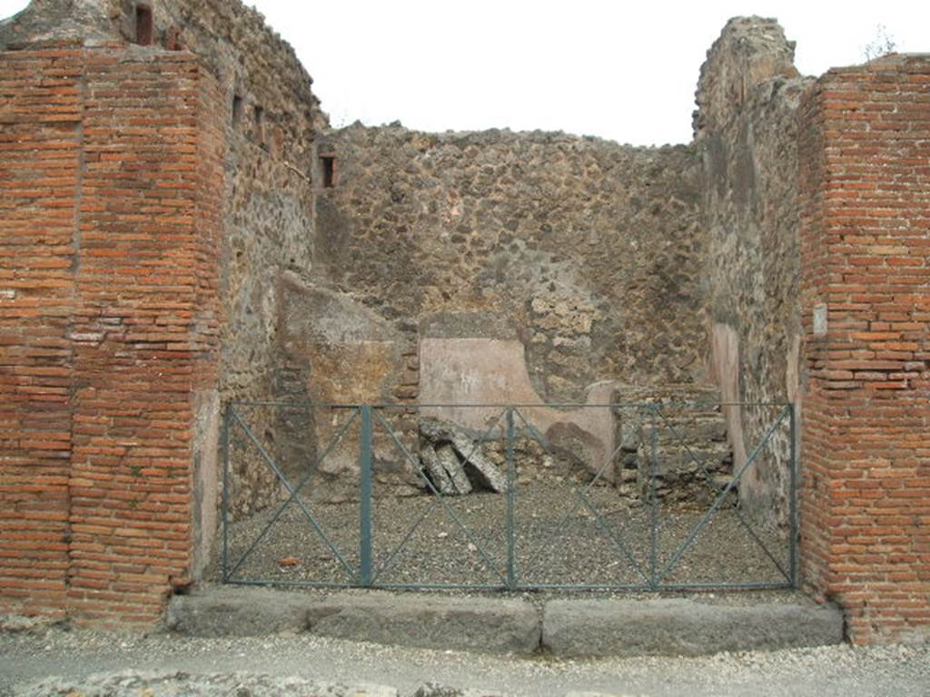 VI.3.5 Pompeii. May 2005. Looking east across entrance doorway towards steps to upper floor, under which was a latrine. 