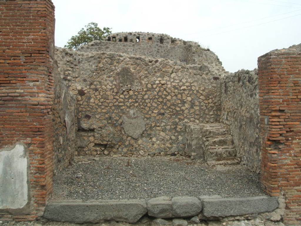 VI.3.9 Pompeii. May 2005. Entrance doorway, looking east across shop. 
Site of latrine in north east corner, and four masonry steps to upper floor in south east corner. See Eschebach, L., 1993. Gebudeverzeichnis und Stadtplan der antiken Stadt Pompeji. Kln: Bhlau. (p.163). According to Fiorelli, this shop had stairs and a latrine.
See Pappalardo, U., 2001. La Descrizione di Pompei per Giuseppe Fiorelli (1875). Napoli: Massa Editore.(p.52).  According to Hobson, there is no evidence of a latrine. See Hobson, B. 2009. Pompeii, Latrines and Down Pipes. Oxford, Hadrian Books, (p.196)
