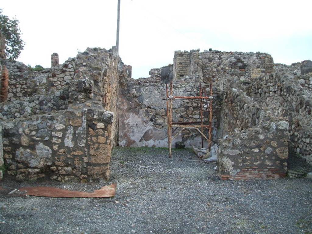 VI.3.12 Pompeii. December 2004. Looking east across shop to large rear room, and corridor.