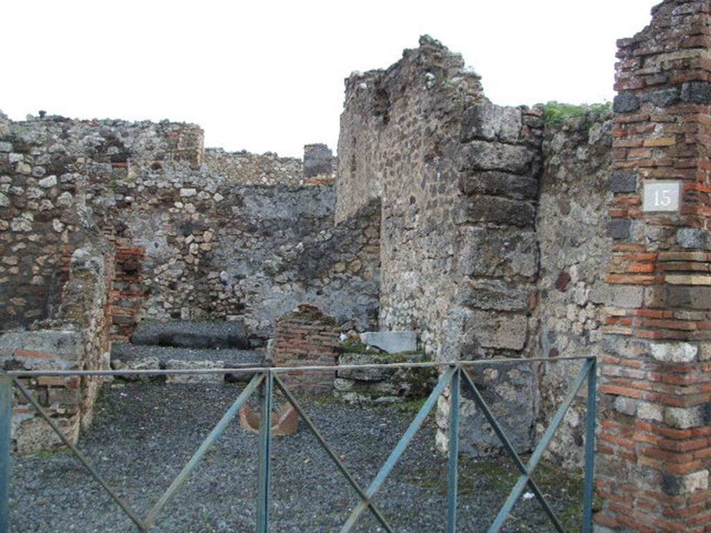 VI.3.15 Pompeii. December 2004. Looking east from Via Consolare.
According to CTP, CIL IV 108 was found here. Howvere, they say Zangemeister located it on the west side (left) of VI.3.20. See Van der Poel, H. B., 1983. Corpus Topographicum Pompeianum, Part II. Austin: University of Texas. (p.249) According to Epigraphik-Datenbank Clauss/Slaby (See www.manfredclauss.de), it read  C(aium) I(ulium) P(riscum) IIvir(um)

On the left can be seen the rear room of the shop, possibly a cubiculum.
On the right near the terracotta remains of a puteal, remains of another room with steps. In the area behind the steps would have been the latrine In the middle a corridor to the rear. At the rear would have been another room, a triclinium or workshop?.  See Eschebach, L., 1993. Gebudeverzeichnis und Stadtplan der antiken Stadt Pompeji. Kln: Bhlau. (p.164) See Pappalardo, U., 2001. La Descrizione di Pompei per Giuseppe Fiorelli (1875). Napoli: Massa Editore. (p.53)

