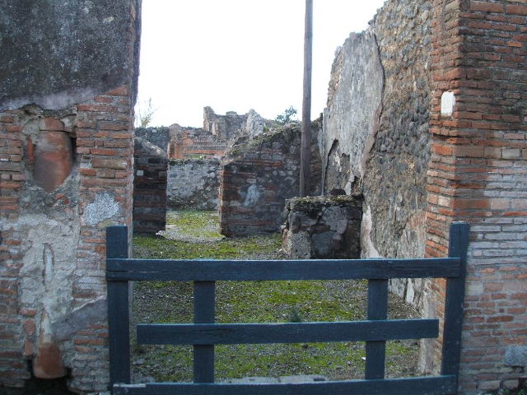 VI.3.22 Pompeii. December 2005. Looking west from wide entrance at rear of VI.3.12.