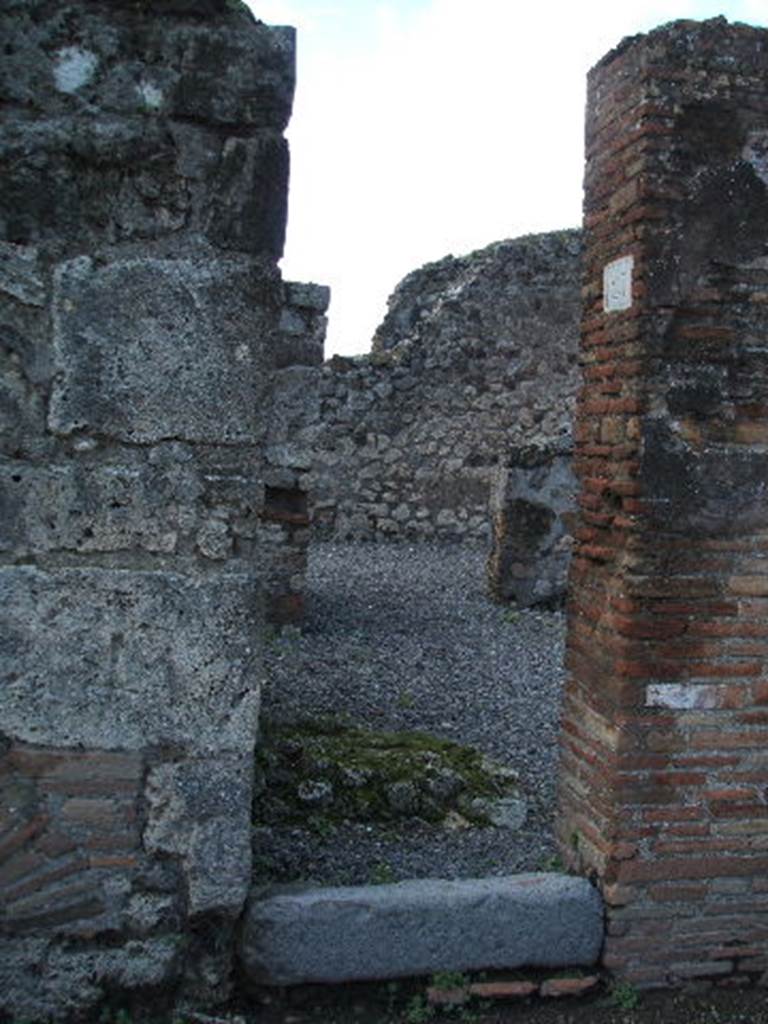 VI.3.23 Pompeii. December 2004. Entrance doorway, looking west.