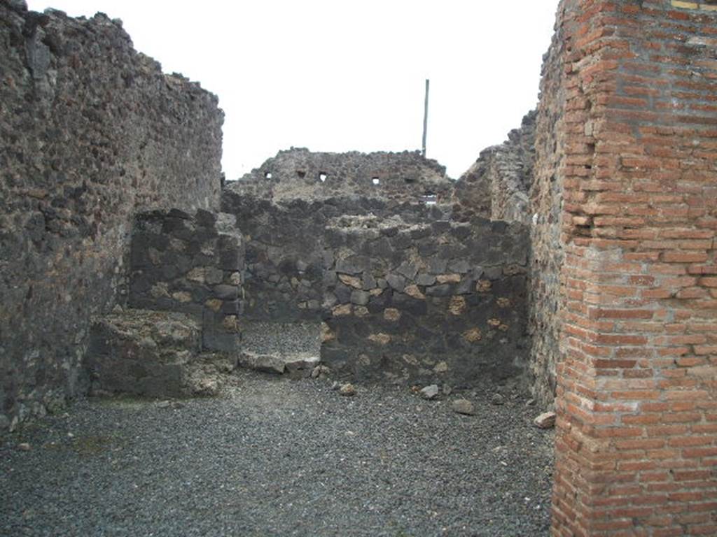 VI.4.6 Pompeii. May 2005. Looking west towards doorway to rear room in centre of west wall.