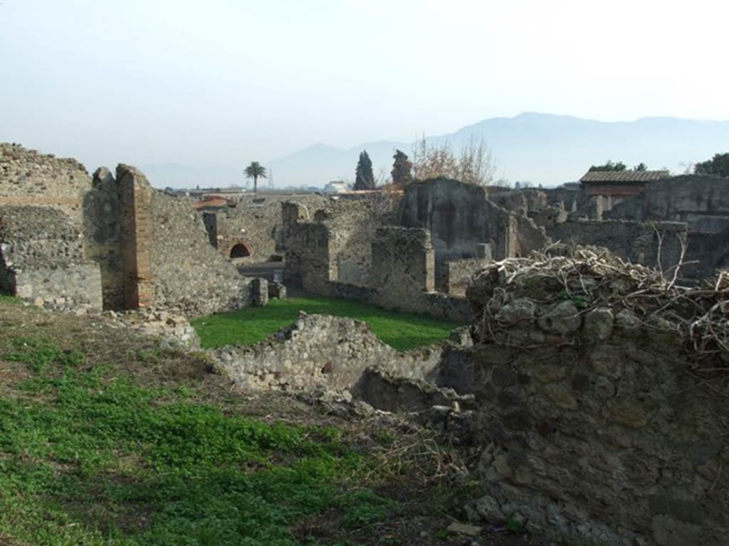 Looking south-east from Tower XII across VI.5.2 and 3 Pompeii. December 2007.