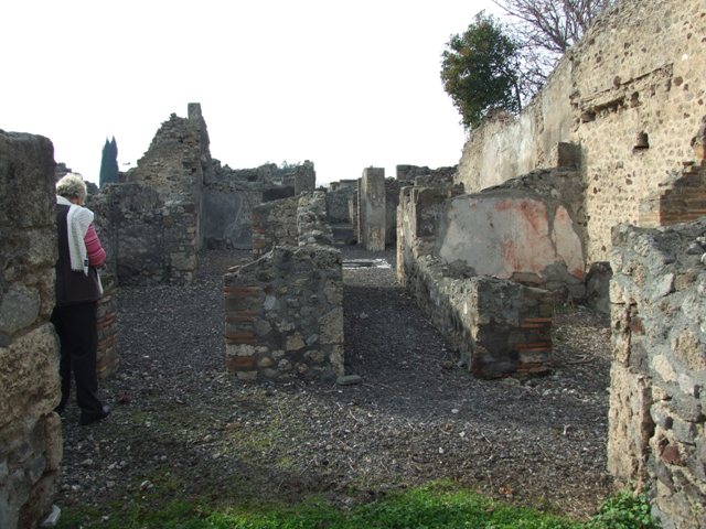 VI.5.8 Pompeii. September 2005. Line of staircase against north wall, and showing holes for beams supporting an upper floor.
