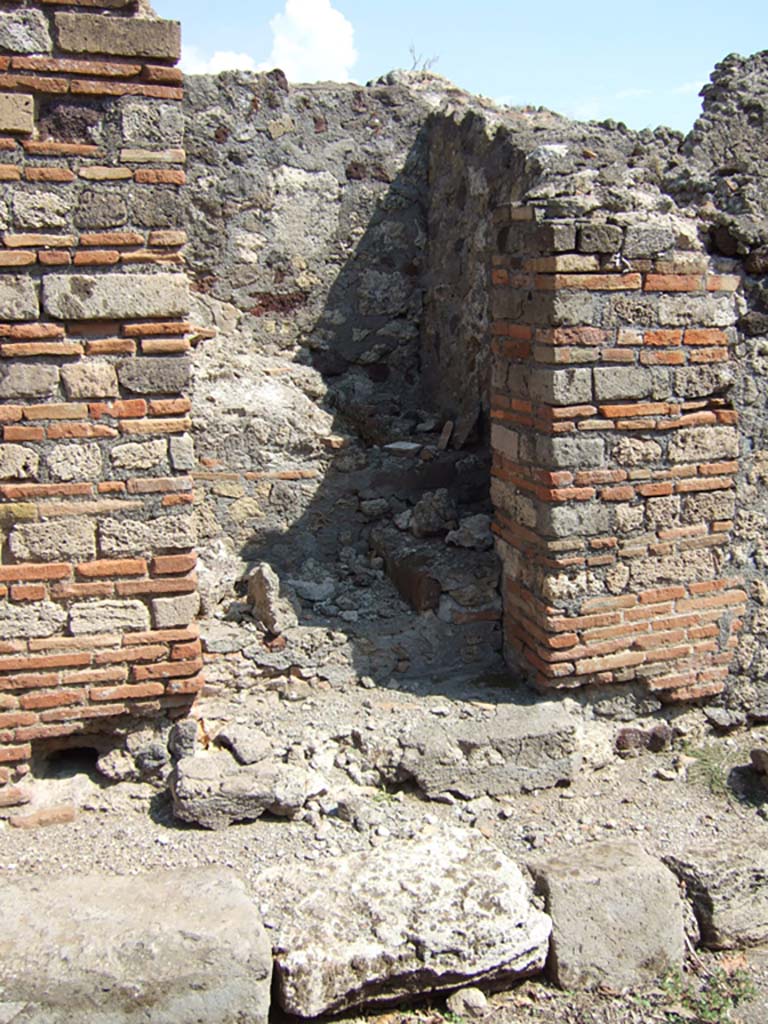 VI.5.11 Pompeii. September 2005. Stairs to an independent dwelling on the upper floor.

According to CTP, the north-west corner of the house at VI.5.14 was excavated in 1817, as well as the pseudoperistyle of VI.5.10 and atrium area of VI.5.9. The street wall at the north-west corner of the house at VI.5.14 collapsed and was reconstructed, which may provide the reason why Tascone, Mau and Eschebach, all indicated a rear doorway to VI.5.14, immediately south of this stairway, which, rightfully should have been assigned a number.  This doorway was delineated by Russos map of 1817, and later by Mazois, Fiorelli  Sorgente, and Zangemeister (1865).  Today the number VI.5.11 is not in situ but it has been assigned by the SANP to this staircase. 
See Van der Poel, H. B., 1981. Corpus Topographicum Pompeianum, Part V. Austin: University of Texas. (p.196-7)


