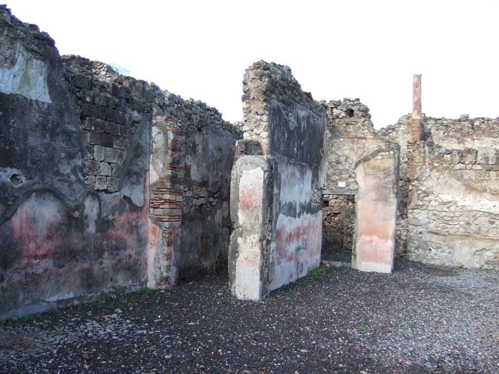 VI.5.16 Pompeii. December 2005. Doorways to rooms on south side of atrium.  


