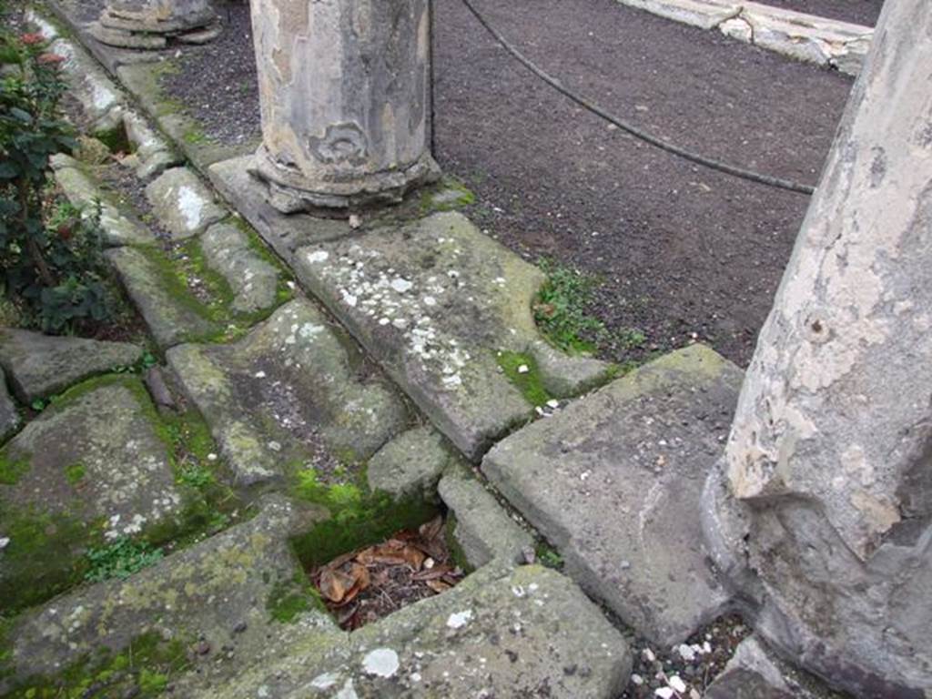 VI.6.1 Pompeii. December 2007. Drainage gutter in north-east corner of peristyle.